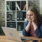 Stressed woman in front of a screen