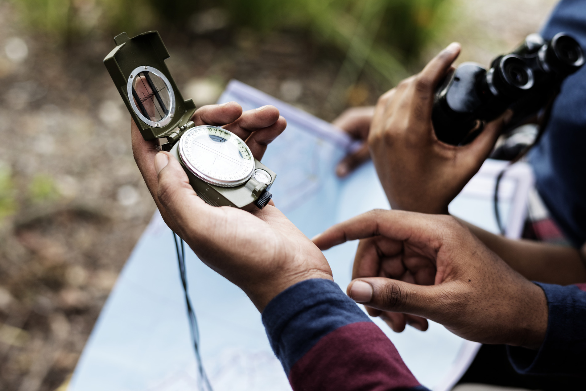 Person holding a compass