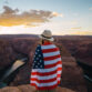 A man with the American flag wrapped around