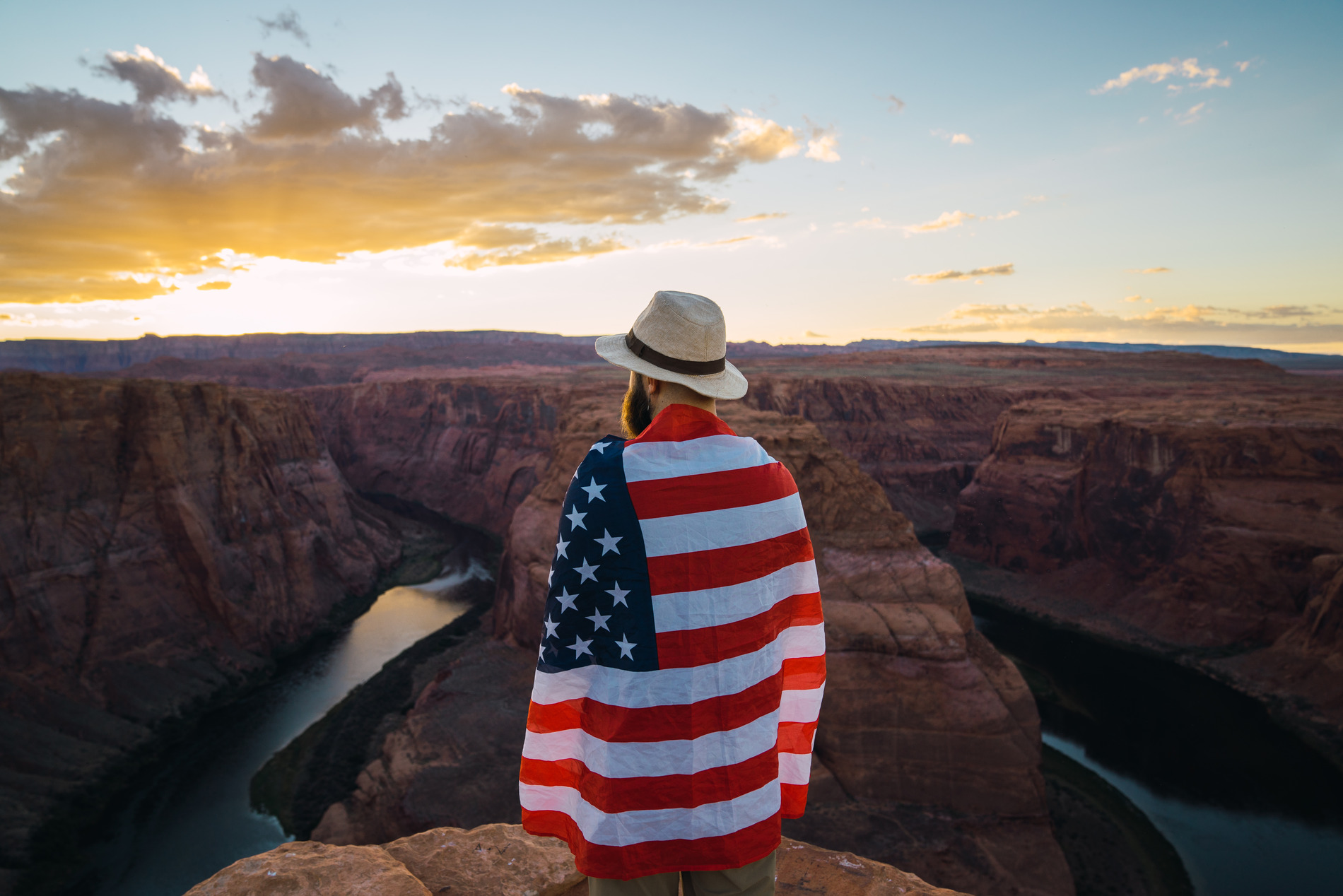 A man with the American flag wrapped around